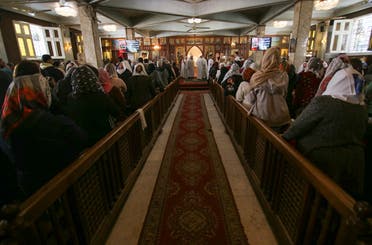 Christian Copts attend Sunday mass and listen to the priest at the Archangel Michael Church after government instructions on preventing the spread of coronavirus, in Cairo, Egypt March 15, 2020. (Reuters)