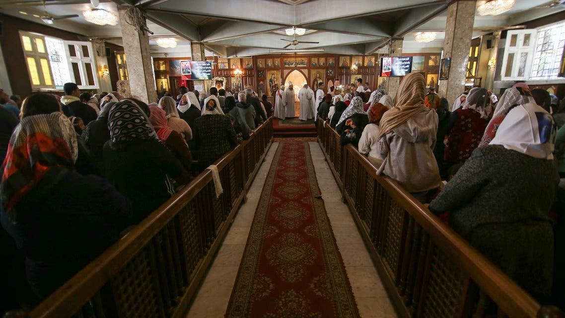 Christian Copts attend Sunday mass and listen to the priest at the Archangel Michael Church after government instructions on preventing the spread of coronavirus, in Cairo, Egypt March 15, 2020. (Reuters)