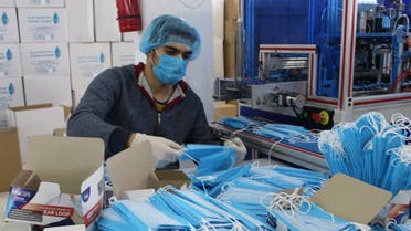 A worker wears a protective face mask and gloves at a factory for masks, as part of precautionary measures against coronavirus, in Misrata, Libya. (Reuters)