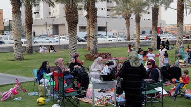 Visitors sit in the garden of the King Fahd Library, following an outbreak of coronavirus, in Riyadh, Saudi Arabia, March 12, 2020. (Reuters)