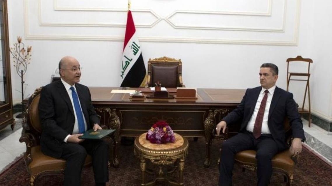 Iraq President Barham Salih, left, with Prime Minister-designate Adnan Al Zurufi at the commissioning ceremony on March 17, 2020. Image @IraqiPresidency via Twitter)