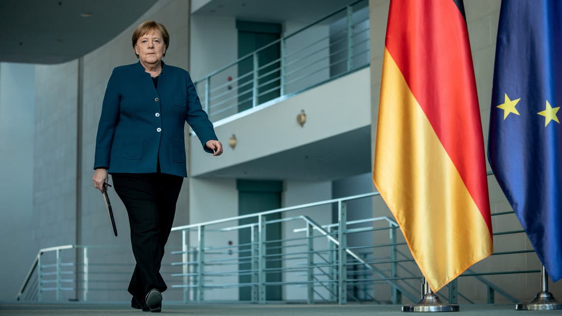 FILE PHOTO: German Chancellor Angela Merkel arrives for a media statement on the spread of the new coronavirus disease (COVID-19) at the Chancellery in Berlin, Germany, March 22, 2020. Michel Kappeler/Pool via REUTERS/File Photo