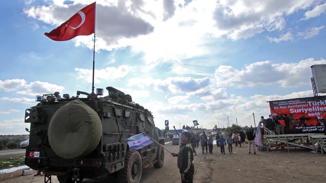, whichA Turkish military vehicle drives on M4 highway links the northern Syrian provinces of Aleppo and Latakia, near the village of al-Nayrab, about 14 kilometres southeast of the city of Idlib and seven kilometres west of Saraqib in northwestern Syria on March 21, 2020.