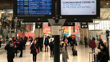 A screen reads : « Coronavirus COVID-19. I protect myself, I protect others », at the Gare du Nord train station in Paris, Wednesday, March 4, 2020. (AP)