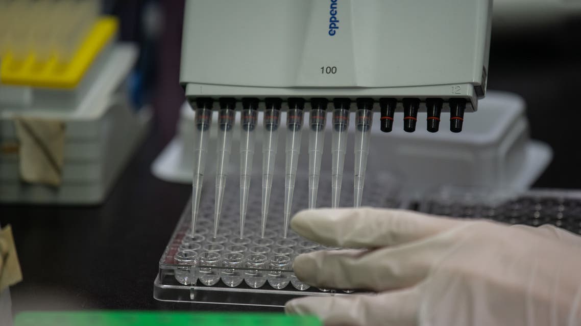 This photo taken on March 11, 2020 shows a lab techician working on a neutralising antibody test on the Middle Eastern Respiratory Syndrome (MERS) coronavirus at a Bio Safety Level (BSL) 3 laboratory at the International Vaccine Institute (IVI) in Seoul. (AFP)