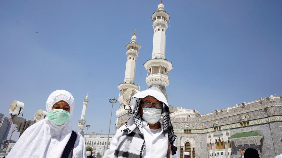 Muslim worshippers wear masks after the noon prayers outside the Grand Mosque, in the Muslim holy city of Mecca, Saudi Arabia on March 7, 2020. (AP)