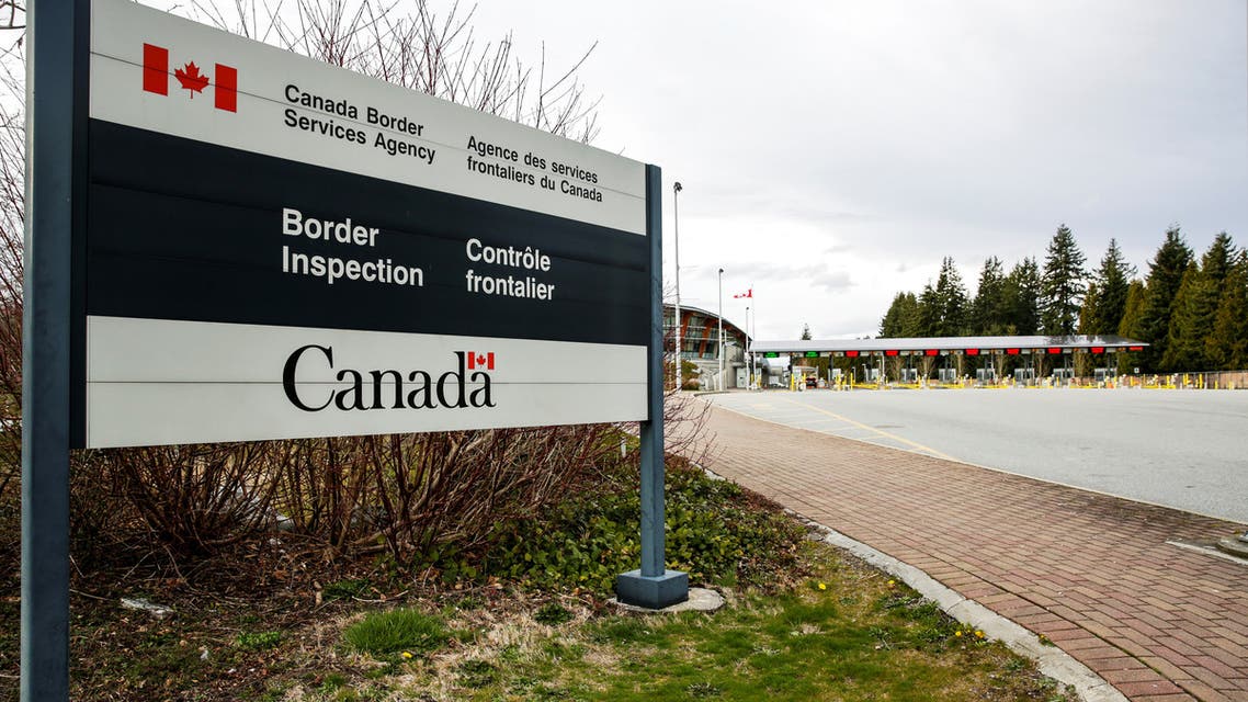The Canada Border Inspection Station is pictured from the U.S. side of the boundary while non-essential travel is temporarily restricted as efforts continue to help slow the spread of coronavirus disease (COVID-19), in Blaine, Washington, U.S. March 23, 2020. REUTERS/Jason Redmond