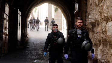 Israeli police patrol deserted street in Jerusalem's Old City, in Jerusalem on March 23, 2020. (AP)