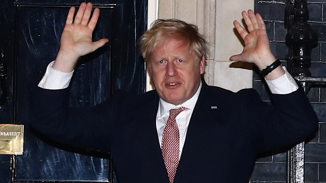Britain's Prime Minister Boris Johnson applauds outside 10 Downing Street during the Clap For Our Carers campaign in support of the NHS, as the spread of the coronavirus disease (COVID-19) continues, London, Britain, March 26, 2020. Pictre taken March 26, 2020. REUTERS/Hannah McKay
