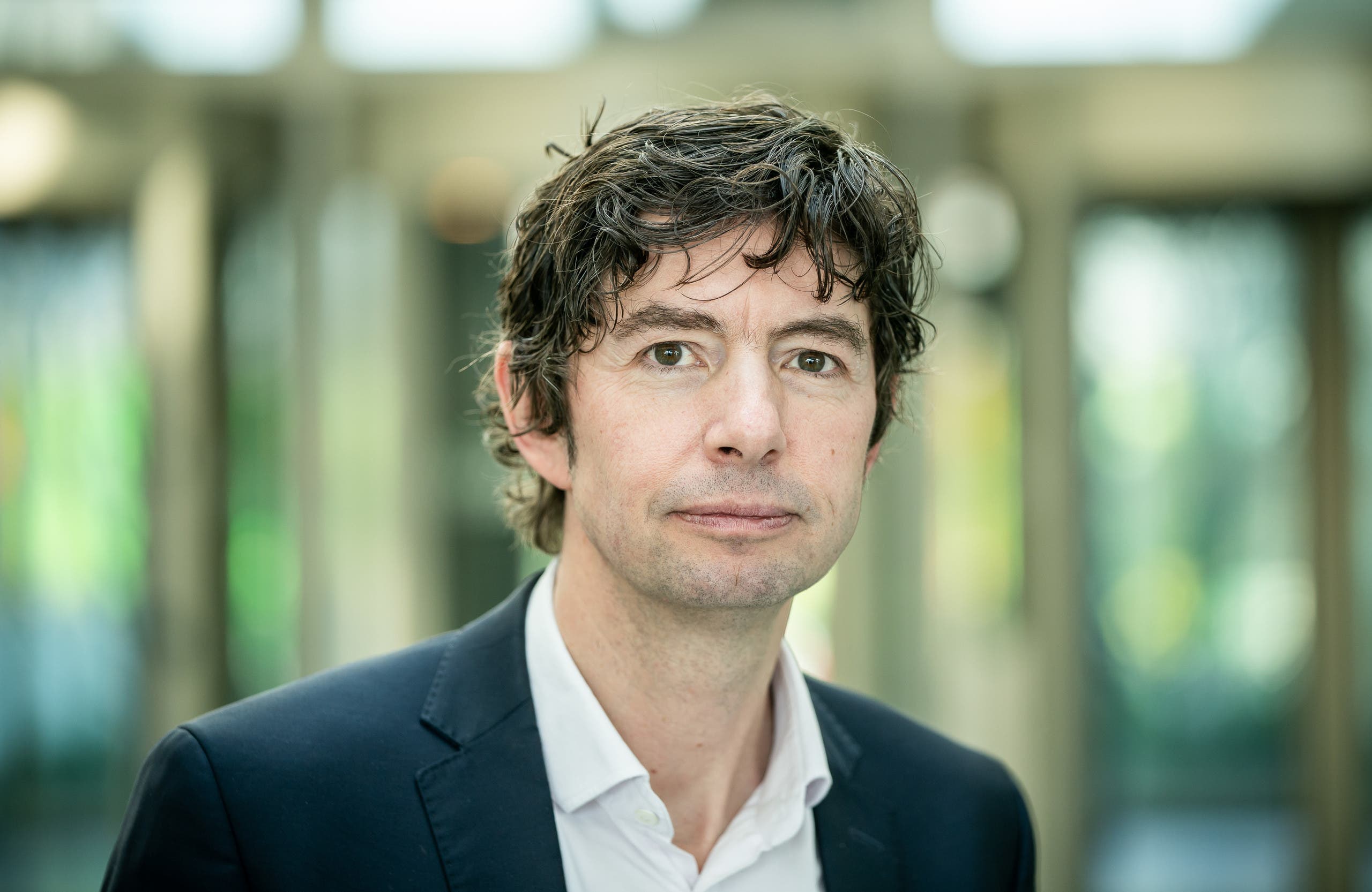 Christian Drosten, director of the Institute of Virology at Berlin's Charite hospital, poses after a press conference in Berlin on March 26, 2020, to comment the spread of the novel coronavirus in the country. (AFP)