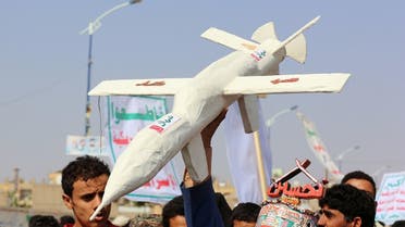 Followers of the Houthi movement carry a mock drone during a rally held to mark the Ashura in Saada. (File photo: Reuters)