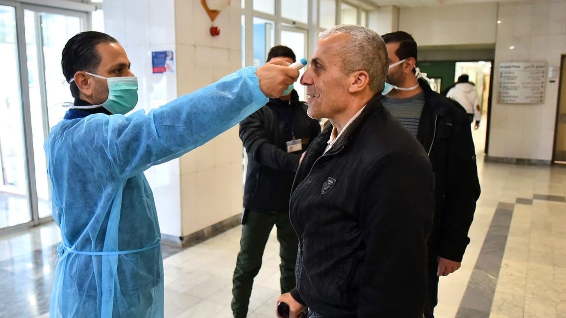 An old man is checked for his temperature at Rafiq Hariri hospital, Lebanon, March 20, 2020. (AFP)