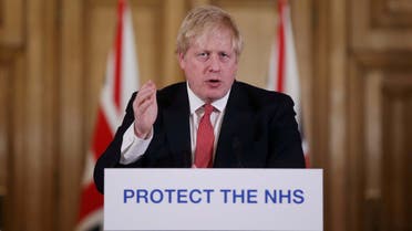FILE PHOTO: Prime Minister Boris Johnson speaks during a news conference on the ongoing situation with the coronavirus disease (COVID-19) in London, Britain March 22, 2020. Ian Vogler/Pool via REUTERS/File Photo