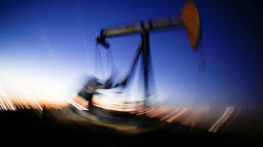 A long exposure image shows the movement of a crude oil pump jack in the Permian Basin in Loving County, Texas, US. (Reuters)