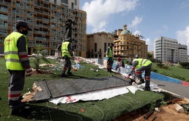 Workers clean the area around Martyrs' Square after Lebanese security forces cleared away a protest camp  in Beirut, Lebanon. (Reuters)