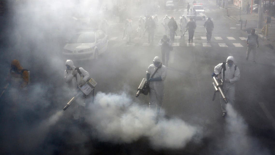 Iranian Firefighters disinfect streets in the capital Tehran in a bid to halt the wild spread of coronavirus on March 13 2020. Iranian forces will clear the streets nationwide within 24 hours and all citizens will be checked for the new coronavirus in a bid to halt its spread, the military said.