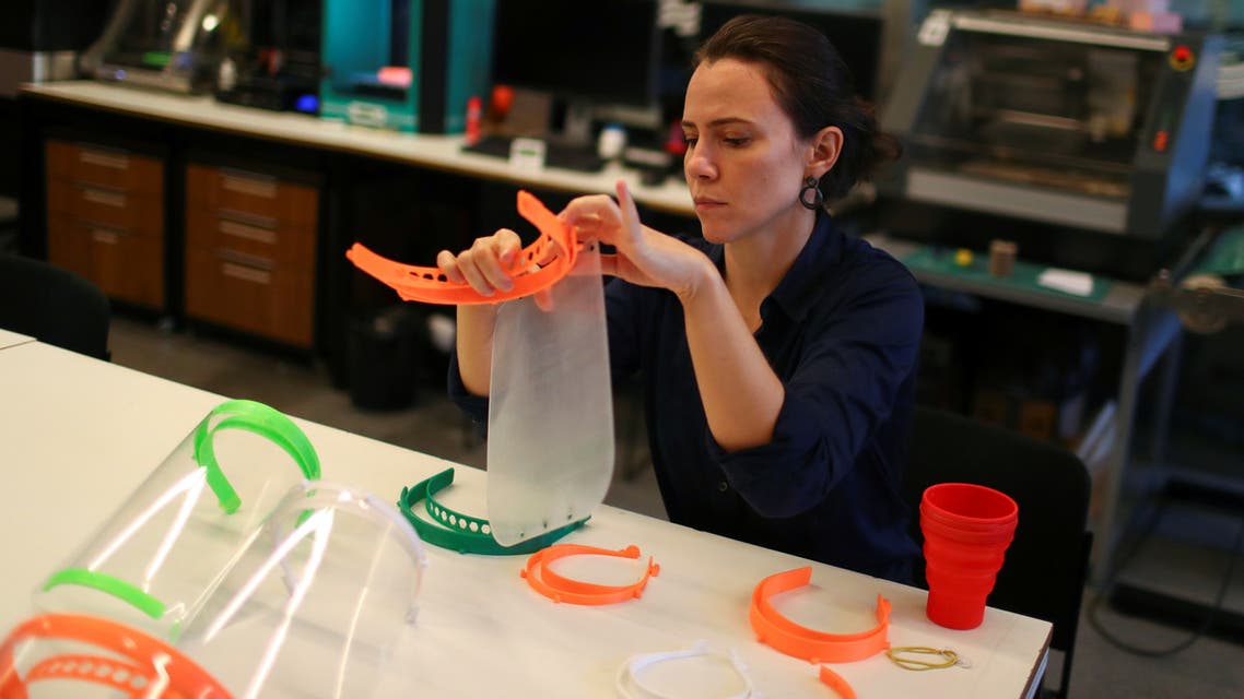 A technical staff tests a 3D printed protective visor made for healthcare professionals, amid the coronavirus disease (COVID-19) outbreak, at the Casa Firjan FabLab in Rio de Janeiro, Brazil March 26, 2020. Picture taken March 26, 2020. REUTERS/Pilar Olivares
