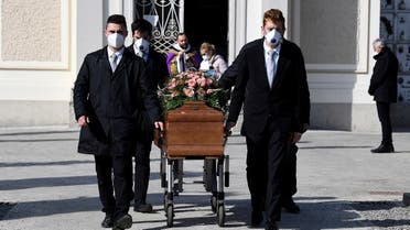 Pallbearers wearing protective masks carry the coffin of a woman who died from coronavirus disease (COVID-19) at her funeral, as Italy struggles to contain the spread of coronavirus disease (COVID-19), in Seriate, Italy March 28, 2020. (Reuters)