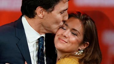 Canadian Prime Minister Justin Trudeau and his wife Sophie Gregoire Trudeau hug on stage after the federal election at the Palais des Congres in Montreal. (Reuters)