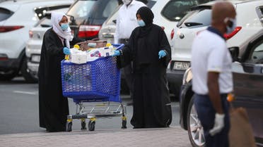 Women leave a supermarket, following the outbreak of the coronavirus disease (COVID-19), in Dubai, United Arab Emirates, March 26, 2020. (Reuters)