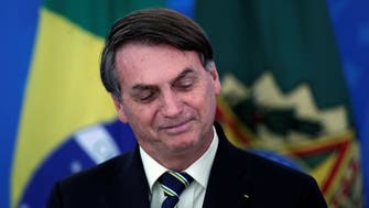 Bolsonaro visits market to stress need to keep Brazil going amid coronavirus