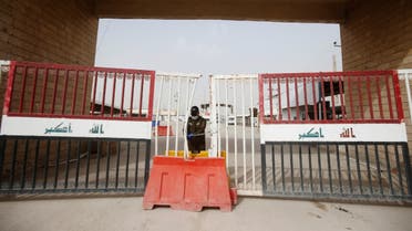 A member of Iraqi Border Guards is seen at the gate of Shalamcha Border Crossing, after Iraq shut a border crossing to travelers between Iraq and Iran, March 8, 2020. (Reuters)  
