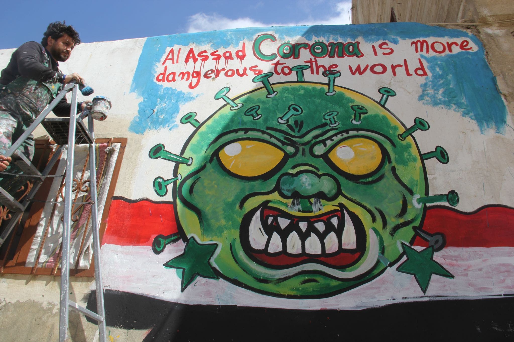 Al Assad Corona is more dangerous to the world, mural by Aziz Asmar in Idlib province. (Mohamad Jamalo)
