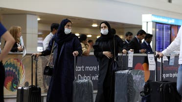 Travellers wear masks as they arrive at the Dubai International Airport, January 29. (Reuters)