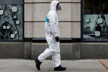 A man wears personal protective equipment (PPE) as he walks on First Avenue, during the coronavirus disease (COVID-19) outbreak, in New York City, U.S., March 31, 2020. (Reuters)