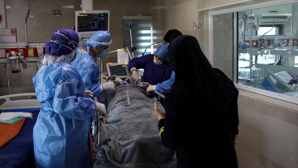 FILE PHOTO: Nurses wearing protective suits, prepare a patient with coronavirus disease (COVID-19) to be transferred to Masih Daneshvari Hospital, in Tehran, Iran March 30, 2020. WANA (West Asia News Agency)/Ali Khara via REUTERS ATTENTION EDITORS - THIS PICTURE WAS PROVIDED BY A THIRD PARTY/File Photo