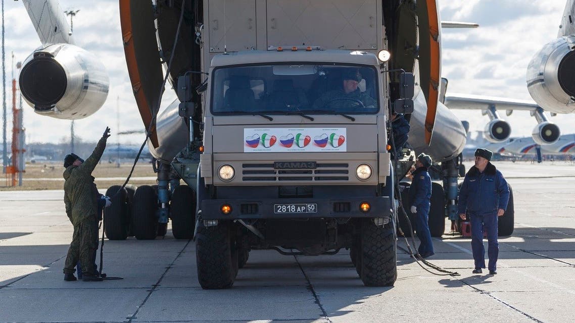 A military truck with stickers reading “From Russia with love” loading a military plane in Moscow as Russia prepares to send medical personnel and supplies to Italy to help the country’s efforts against the coronavirus. (AP)