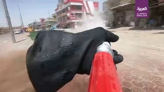 Coronavirus: Iraqi riot police use water cannons to disinfect streets of Basra