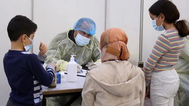 Expatriate returning from Egypt, Syria, and Lebanon arrive to be re-tested at a Kuwaiti health ministry containment and screening zone for COVID-19 coronavirus disease in Kuwait City on March 16, 2020. Facing a mounting public health threat, Saudi Arabia, the United Arab Emirates, Kuwait, Bahrain, Qatar and Oman have taken drastic measures to combat the pandemic. Kuwait has taken the strictest measures in the GCC by largely locking down the country over the weekend.