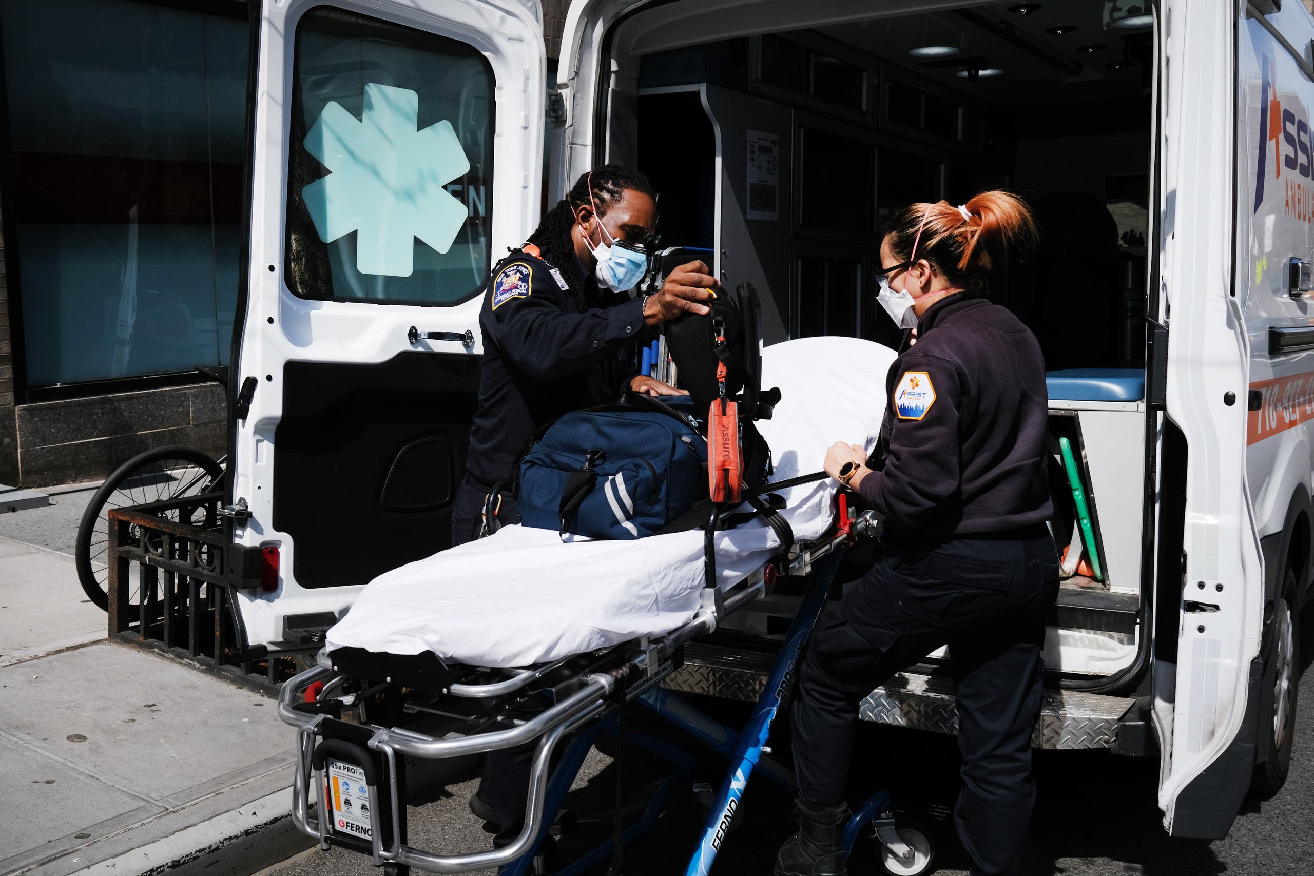 Ambulance workers clean a gurney at Mount Sinai Hospital amid the coronavirus pandemic on April 01, 2020 in New York City. (AFP)