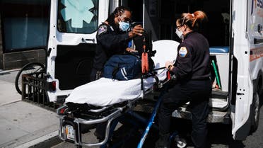 NEW YORK, NY APRIL 01: Ambulance workers clean a gurney at Mount Sinai Hospital amid the coronavirus pandemic on April 01, 2020 in New York City. Hospitals in New York City, the nation's current epicenter of the COVID-19 outbreak, are facing shortages of beds, ventilators and protective equipment for medical staff. Currently, over 75, 000 New Yorkers have tested positive for COVID-19. Spencer Platt/Getty Images/AFP 