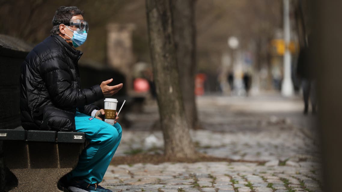 NEW YORK, NY APRIL 01: A medical worker takes a break outside of Mount Sinai Hospital amid the coronavirus pandemic on April 01, 2020 in New York City. Hospitals in New York City, the nation's current epicenter of the COVID-19 outbreak, are facing shortages of beds, ventilators and protective equipment for medical staff. Currently, over 75, 000 New Yorkers have tested positive for COVID-19. Spencer Platt/Getty Images/AFP