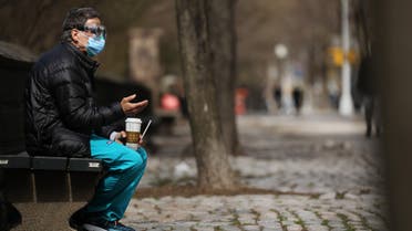 NEW YORK, NY APRIL 01: A medical worker takes a break outside of Mount Sinai Hospital amid the coronavirus pandemic on April 01, 2020 in New York City. Hospitals in New York City, the nation's current epicenter of the COVID-19 outbreak, are facing shortages of beds, ventilators and protective equipment for medical staff. Currently, over 75, 000 New Yorkers have tested positive for COVID-19. Spencer Platt/Getty Images/AFP 