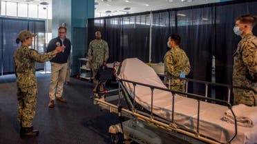 US Navy acting Secretary Thomas B. Modly is toured through the patient transfer process at the Military Sealift Command hospital ship USNS Mercy (T-AH 19), March 31, 2020. (US Navy via AP)