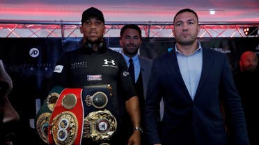 Anthony Joshua and Kubrat Pulev pose during a press conference. (Action Images via Reuters)