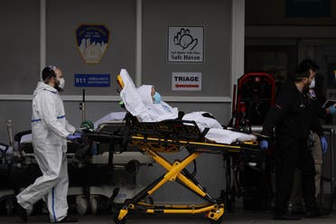 Medical workers take in patients at a special coronavirus intake area at Maimonides Medical Center in the Borough Park neighborhood on April 05, 2020 in the Brooklyn Borough of New York City. (AFP)