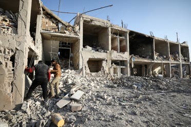 Men inspect the rubble of a hospital that was reportedly hit by a reported air strike in the Syrian village of Shinan, about 30 kilometres south of Idlib in the northwestern Idlib province, on November 6, 2019. 