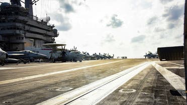 Planes are parked on the flight deck of the US Navy aircraft carrier USS Theodore Roosevelt in the Philippine Sea March 18, 2020. (Reuters)