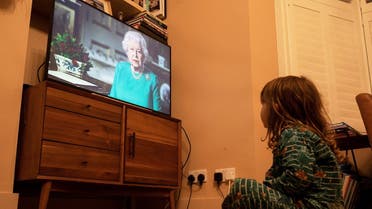 Isaac (4) watches Britain's Queen Elizabeth II during a televised address to the nation, as the spread of the coronavirus disease (COVID-19) continues, London, Britain. (Reuters)