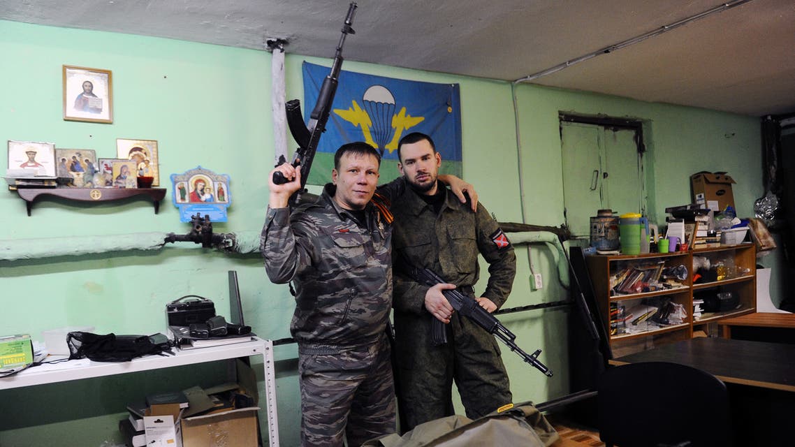 (FILES) This file photo taken on February 28, 2015 shows members of the “Russian Imperial Movement”, a nationalist group in Russia, volunteers of the self-declared Donetsk People's Republic Dmitry Gaydun nick-named Donskoy (R) and Sergei Zinchenko nick-named Shtrafbat posing for a picture with weapon simulators at a training base in Saint-Petersburg. The United States on April 6, 2020 branded a Russian far-right group as a foreign terrorist organization, the first time it has targeted white supremacists with tools regularly used against Islamist extremists. The State Department said that the Russian Imperial Movement runs paramilitary training camps in St. Petersburg and has drawn neo-Nazis from across the Western world.