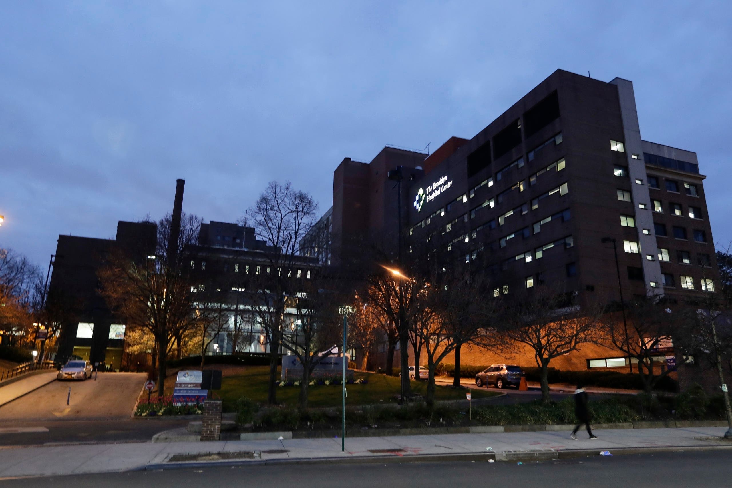 Pedestrians pass Brooklyn Hospital Center on Saturday, April 4, 2020, in the Brooklyn borough of New York. (AP)