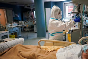 A medical staffer tends to a patient In the ICU unit of Rome's San Filippo Neri Hospital's Covid department on April 9, 2020. (AP)