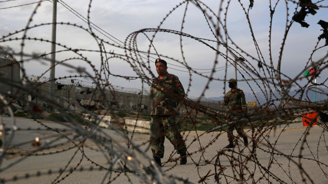Afghan National Army soldiers stand guard at a checkpoint near the Bagram base in northern Kabul, Afghanistan, Wednesday, April 8, 2020. (AP)