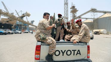 Yemen's Houthi militia ride in the back of vehicle during withdrawal from Saleef port in Hodeidah province. (Reuters)