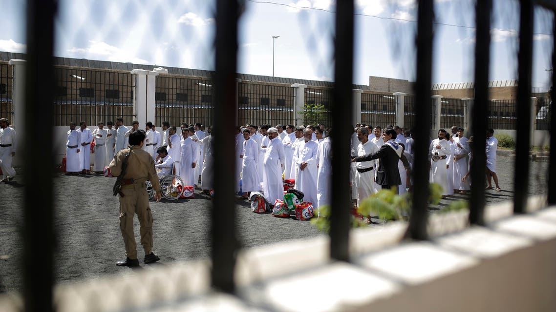 Yemeni detainees stand as they wait for their release from a prison controlled by Houthi rebels, in Sanaa, Yemen on Sept. 30, 2019. (AP)