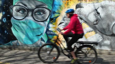 A graffiti representing a nurse by artist David S.I.D. Perez is pictured on a wall as part of a serie to pay tribute to essential workers during the coronavirus disease (COVID-19) outbreak in Gland, Switzerland. (Reuters)